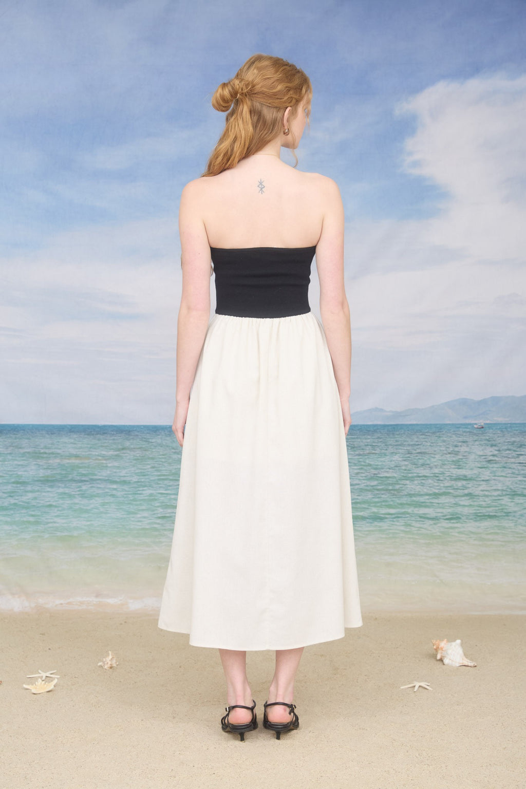 VESTIDO STRAPLE TOP NEGRO FALDA ARENA